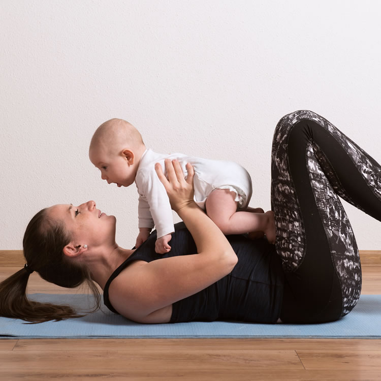 Therapist guiding a patient through pelvic floor and core stability exercises