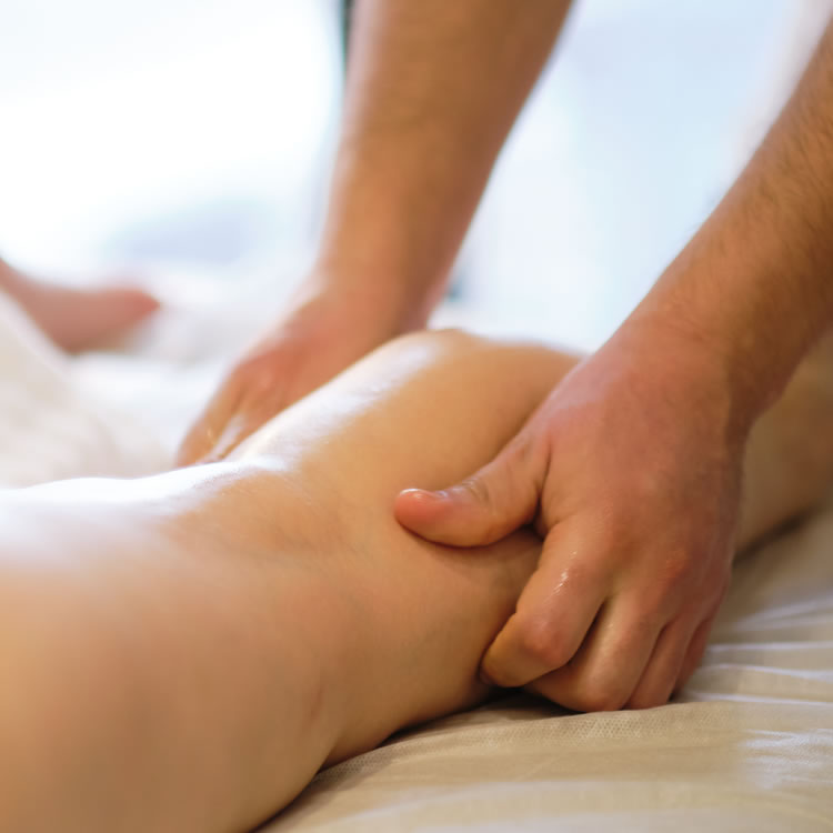 Therapist performing manual lymphatic drainage massage